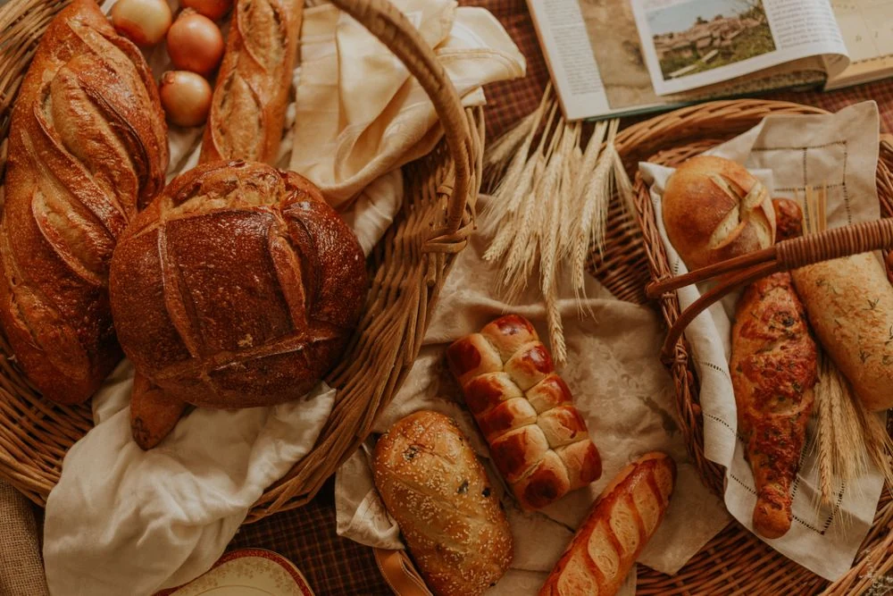 An assortment of bread in wicker baskets